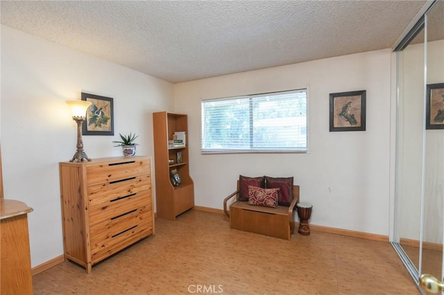 5295 Bronson Way, Riverside, CA 92506 - sitting room with a textured ceiling and light flooring