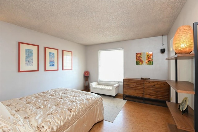 5295 Bronson Way, Riverside, CA 92506 - bedroom featuring wood finished floors and a textured ceiling