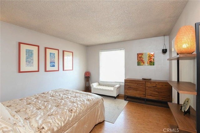 5295 Bronson Way, Riverside, CA 92506 - bedroom featuring wood finished floors and a textured ceiling