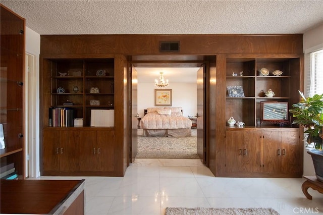 5295 Bronson Way, Riverside, CA 92506 - bedroom featuring a textured ceiling and a chandelier
