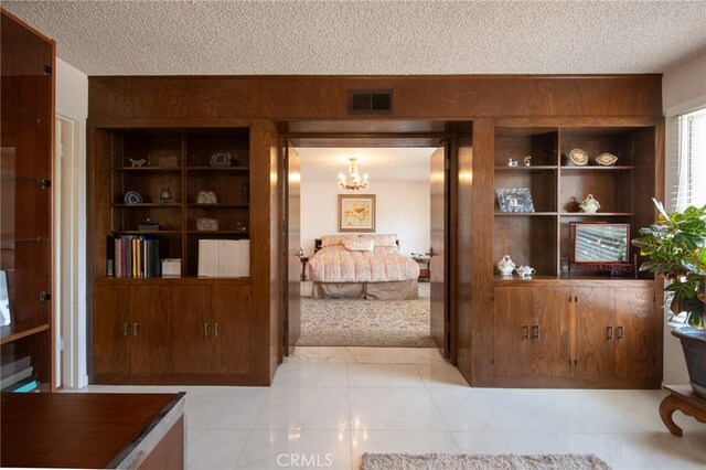 5295 Bronson Way, Riverside, CA 92506 - bedroom featuring a textured ceiling and a chandelier