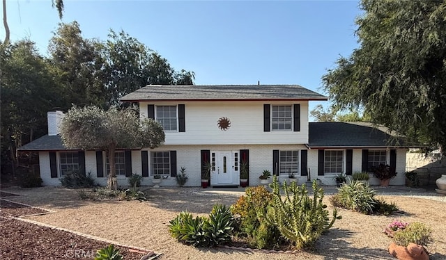 5295 Bronson Way, Riverside, CA 92506 - view of front of home with brick siding and a chimney
