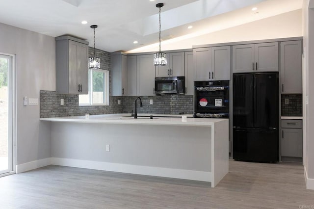 13233 Beechtree St, Lakeside, CA 92040 - kitchen with black appliances, gray cabinets, vaulted ceiling, a peninsula, and healthy amount of natural light