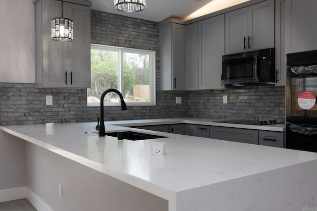 13233 Beechtree St, Lakeside, CA 92040 - kitchen featuring black appliances, gray cabinets, light stone counters, and backsplash