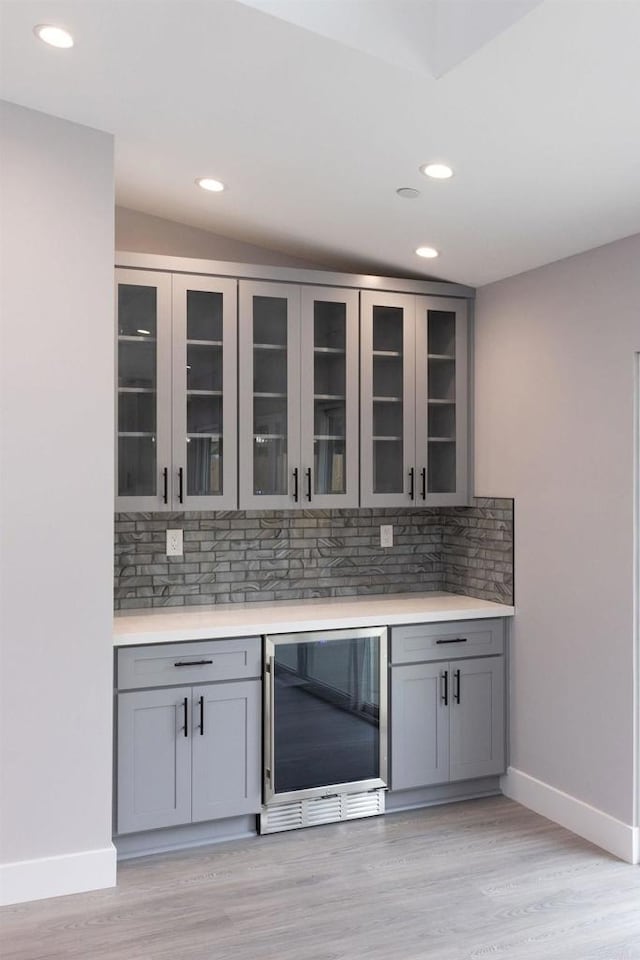 13233 Beechtree St, Lakeside, CA 92040 - bar area with beverage cooler, recessed lighting, decorative backsplash, and light wood finished floors