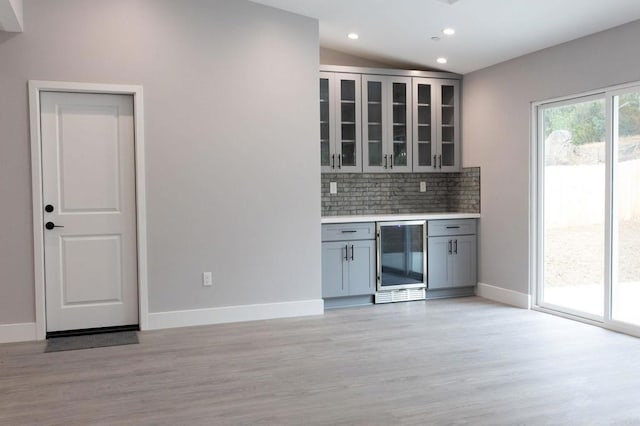 13233 Beechtree St, Lakeside, CA 92040 - bar with wine cooler, light wood finished floors, decorative backsplash, and recessed lighting