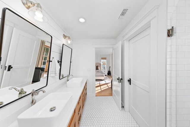 2103 Loquat Pl, Oceanside, CA 92054 - full bathroom featuring ensuite bath, double vanity, tile patterned floors, and recessed lighting