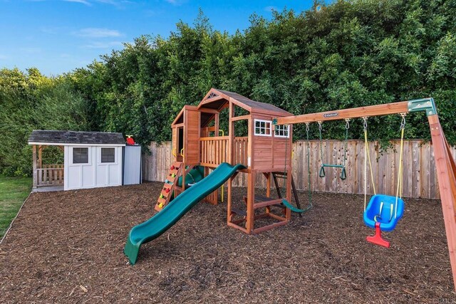2103 Loquat Pl, Oceanside, CA 92054 - view of jungle gym featuring an outbuilding