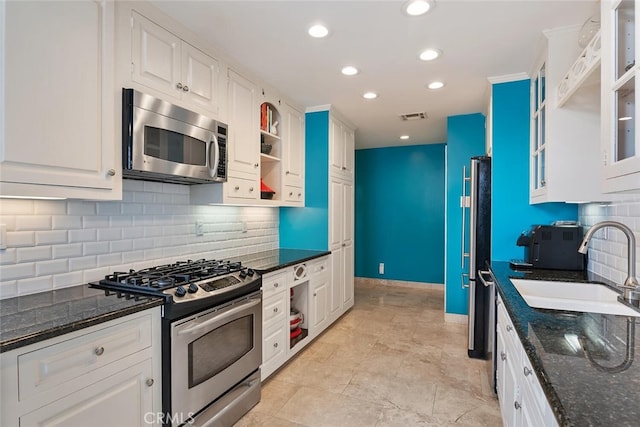 13331 Moorpark St Unit 316, Sherman Oaks, CA 91423 - kitchen featuring stainless steel appliances, white cabinetry, decorative backsplash, dark stone countertops, and recessed lighting