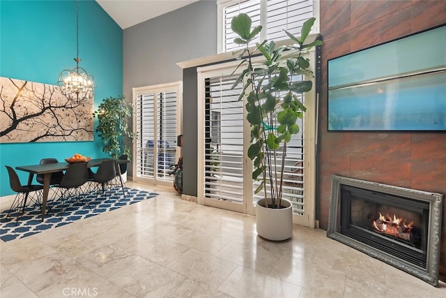 13331 Moorpark St Unit 316, Sherman Oaks, CA 91423 - living area with high vaulted ceiling, a chandelier, and a tile fireplace