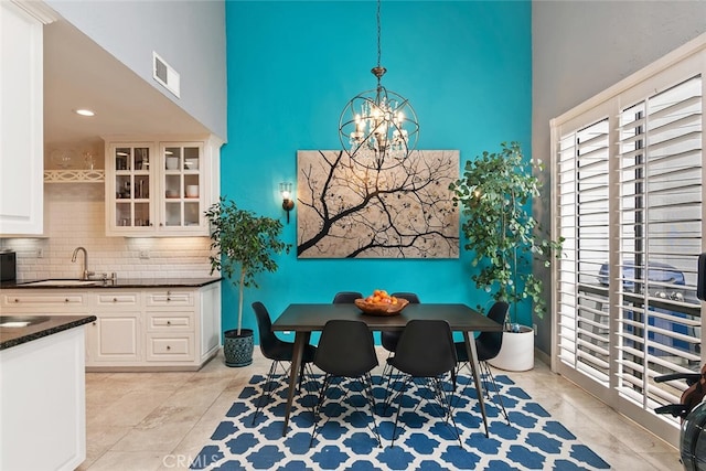 13331 Moorpark St Unit 316, Sherman Oaks, CA 91423 - dining area with a high ceiling, a chandelier, and recessed lighting