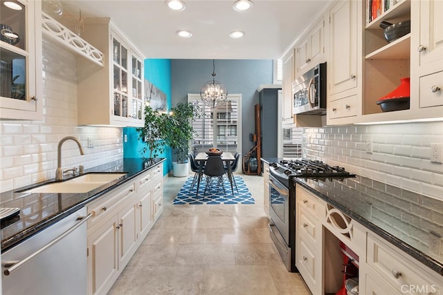 13331 Moorpark St Unit 316, Sherman Oaks, CA 91423 - kitchen featuring stainless steel appliances, a chandelier, recessed lighting, dark stone counters, and open shelves