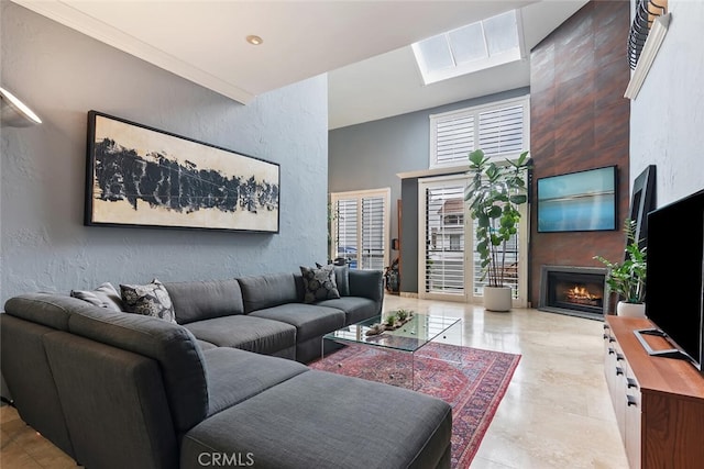 13331 Moorpark St Unit 316, Sherman Oaks, CA 91423 - living room featuring a large fireplace, a towering ceiling, a textured wall, and a skylight