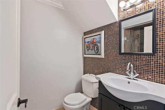 13331 Moorpark St Unit 316, Sherman Oaks, CA 91423 - full bathroom featuring tile walls, vaulted ceiling, vanity, tiled shower, and crown molding