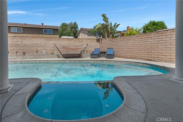 13520 Preciado Ave, Chino, CA 91710 - view of swimming pool with a fenced backyard and a pool with connected hot tub
