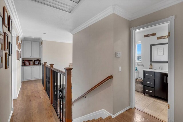 13520 Preciado Ave, Chino, CA 91710 - hallway featuring an upstairs landing, light wood-style floors, and crown molding