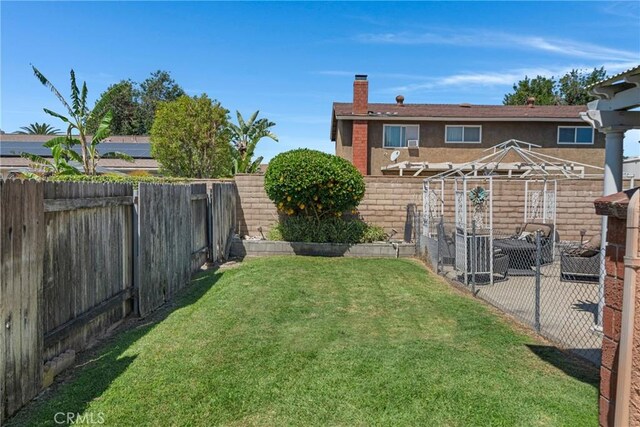 13520 Preciado Ave, Chino, CA 91710 - fenced backyard featuring a patio area