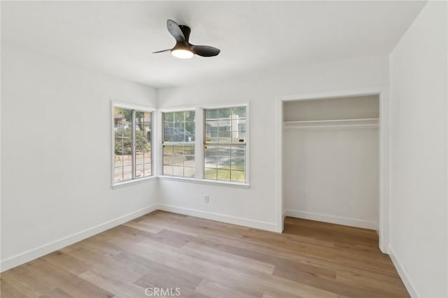 717 La Porte Ave, San Bernardino, CA 92405 - unfurnished bedroom featuring light wood-style floors, a closet, and ceiling fan