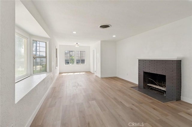 717 La Porte Ave, San Bernardino, CA 92405 - unfurnished living room featuring wood finished floors, a fireplace, and recessed lighting