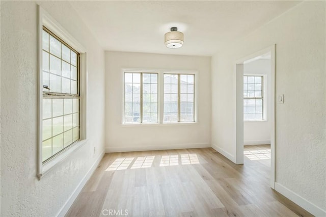 717 La Porte Ave, San Bernardino, CA 92405 - spare room with a textured wall and wood finished floors