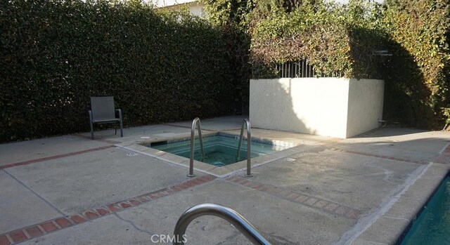 13080 Dronfield Ave Unit 80, Sylmar, CA 91342 - view of swimming pool with an in-ground hot tub and a patio