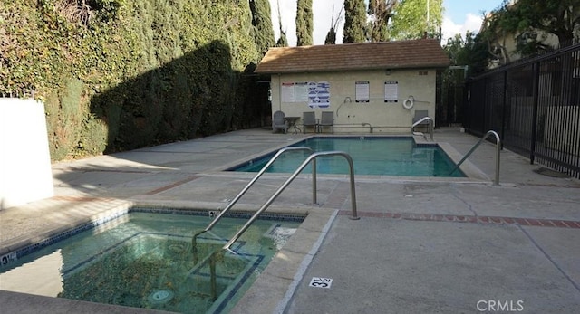 13080 Dronfield Ave Unit 80, Sylmar, CA 91342 - community pool featuring a patio, an outdoor structure, and a community hot tub