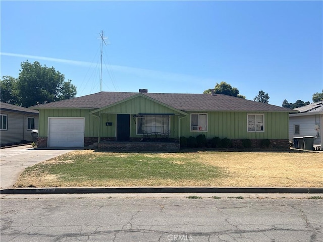 3029 Sycamore Ave, Merced, CA 95340 - single story home featuring an attached garage, concrete driveway, a shingled roof, a front lawn, and board and batten siding