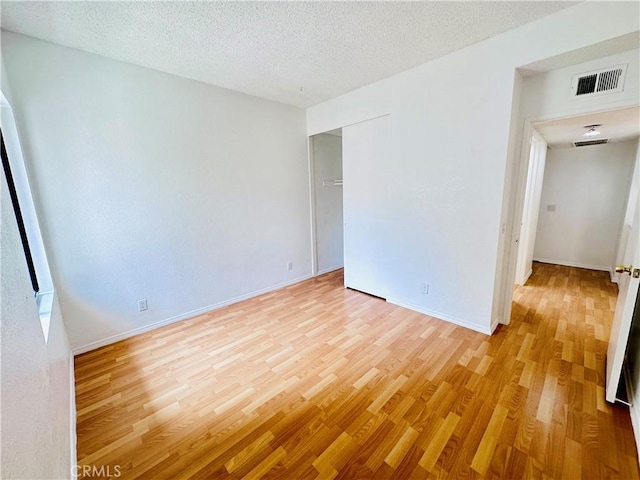 343 Park Shadow Ct, Baldwin Park, CA 91706 - unfurnished room with light wood-style floors and a textured ceiling