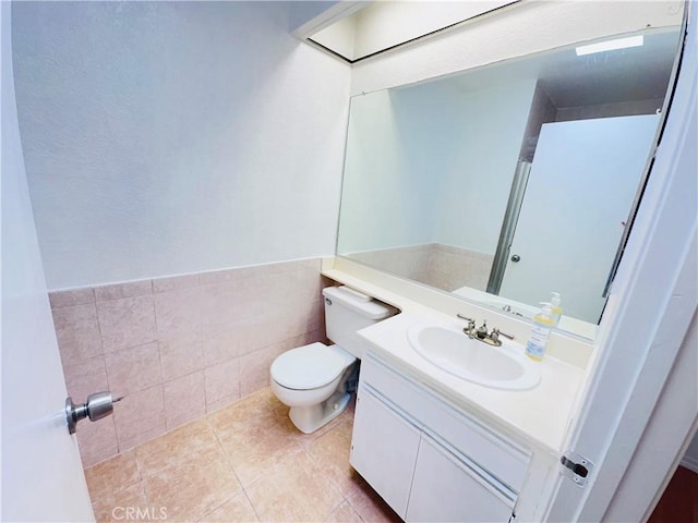 343 Park Shadow Ct, Baldwin Park, CA 91706 - bathroom with vanity, a wainscoted wall, tile walls, and tile patterned flooring