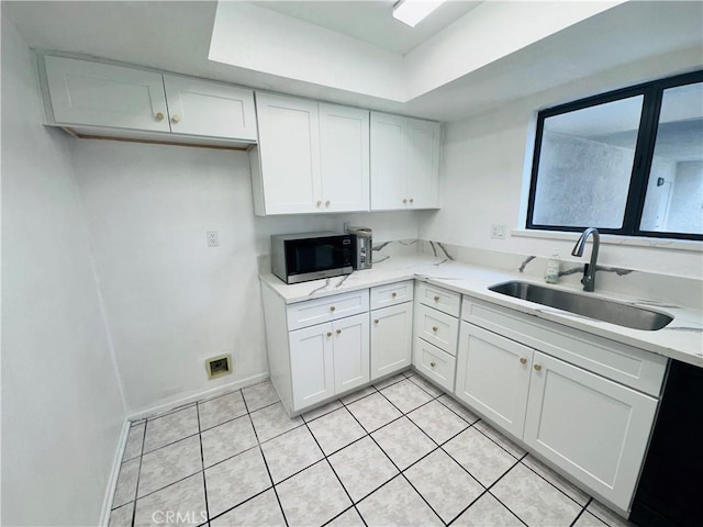 343 Park Shadow Ct, Baldwin Park, CA 91706 - kitchen featuring dishwashing machine, white cabinets, a raised ceiling, light tile patterned flooring, and light stone countertops