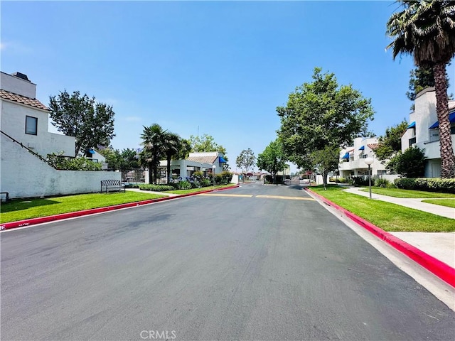 343 Park Shadow Ct, Baldwin Park, CA 91706 - view of asphalt street with a residential view, curbs, and sidewalks