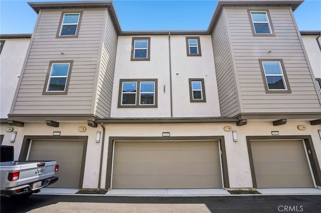 1549 Stratus Dr, Pomona, CA 91768 - view of front facade featuring stucco siding and a garage