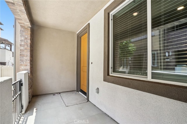 1549 Stratus Dr, Pomona, CA 91768 - property entrance featuring stucco siding and a balcony