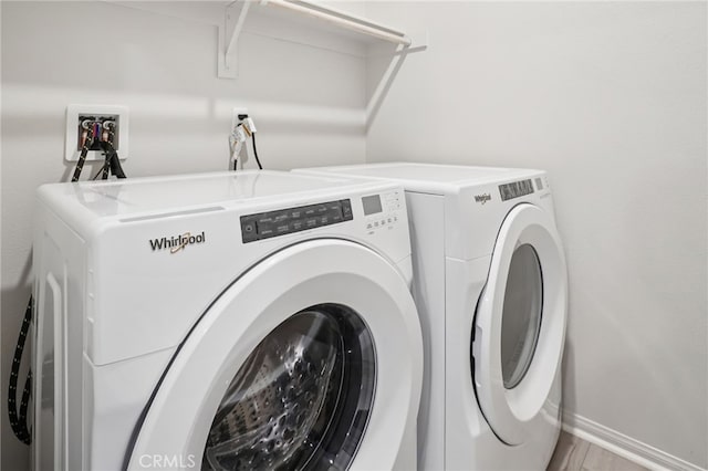 1549 Stratus Dr, Pomona, CA 91768 - laundry room featuring separate washer and dryer and baseboards