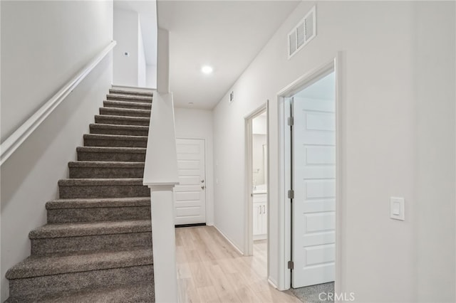 1549 Stratus Dr, Pomona, CA 91768 - staircase featuring wood finished floors and recessed lighting