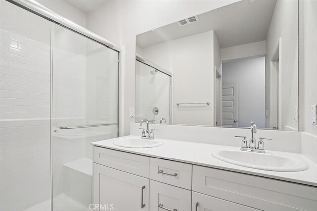 1549 Stratus Dr, Pomona, CA 91768 - bathroom with a stall shower and double vanity