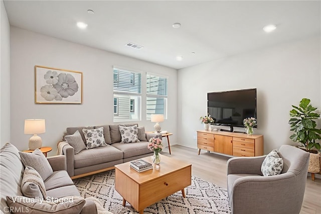 1549 Stratus Dr, Pomona, CA 91768 - living room featuring light wood finished floors and recessed lighting