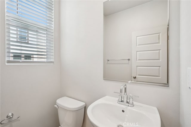 1549 Stratus Dr, Pomona, CA 91768 - half bathroom featuring a sink and toilet
