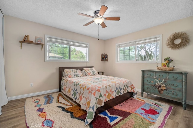 3542 Lillian St, Riverside, CA 92504 - bedroom with a textured ceiling, wood finished floors, and a ceiling fan