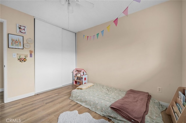 3542 Lillian St, Riverside, CA 92504 - bedroom with wood finished floors, a ceiling fan, and a closet