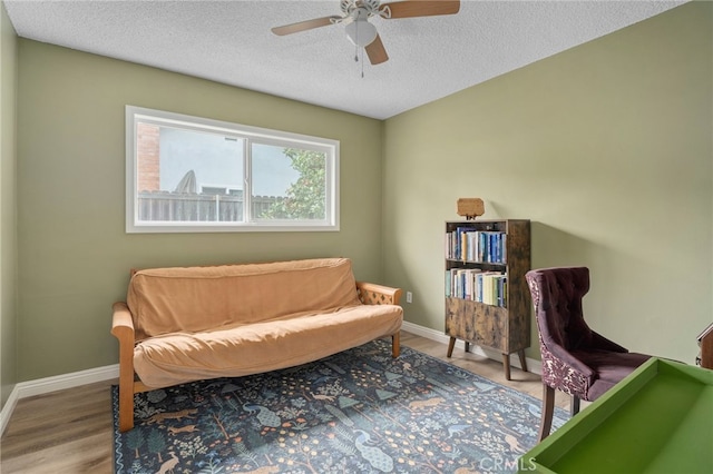 3542 Lillian St, Riverside, CA 92504 - living area featuring ceiling fan, a textured ceiling, and wood finished floors