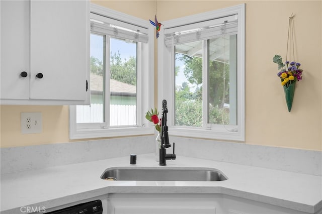 3542 Lillian St, Riverside, CA 92504 - kitchen view of light countertops, white cabinets, and dishwashing machine