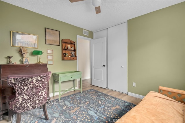 3542 Lillian St, Riverside, CA 92504 - home office with wood finished floors, ceiling fan, and a textured ceiling