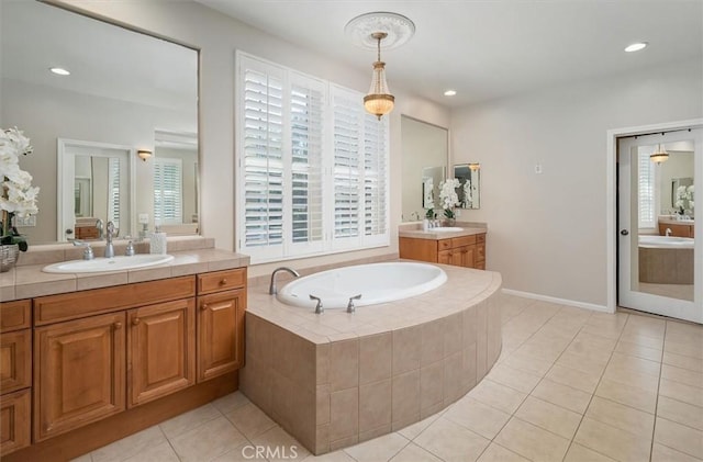 26860 Chaucer Pl, Stevenson Ranch, CA 91381 - bathroom with two vanities, a bath, tile patterned floors, and recessed lighting