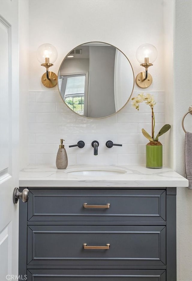 26860 Chaucer Pl, Stevenson Ranch, CA 91381 - bathroom featuring vanity and decorative backsplash
