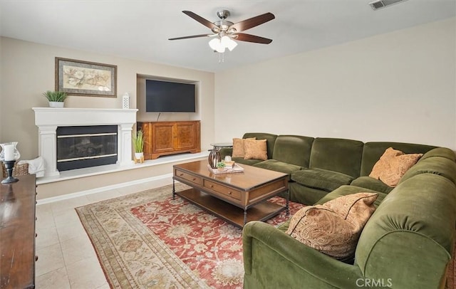 26860 Chaucer Pl, Stevenson Ranch, CA 91381 - tiled living area with ceiling fan and a glass covered fireplace