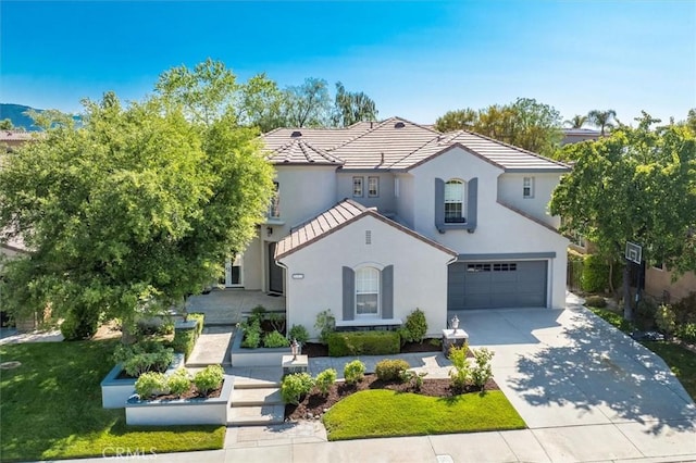 26860 Chaucer Pl, Stevenson Ranch, CA 91381 - mediterranean / spanish home featuring concrete driveway, a garage, stucco siding, and a tile roof