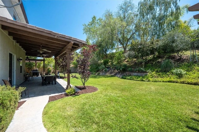 26860 Chaucer Pl, Stevenson Ranch, CA 91381 - view of grassy yard with a ceiling fan and a patio area