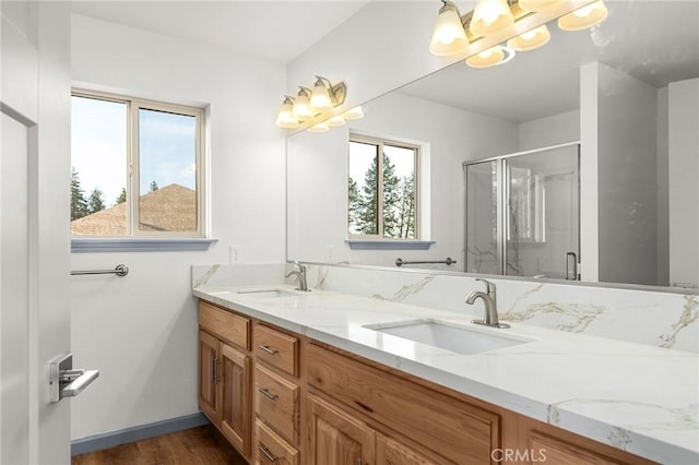 8412 Montna Dr, Paradise, CA 95969 - full bathroom with double vanity, a stall shower, a chandelier, and wood finished floors