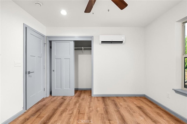 8412 Montna Dr, Paradise, CA 95969 - unfurnished bedroom with an AC wall unit, light wood-type flooring, a closet, recessed lighting, and a ceiling fan